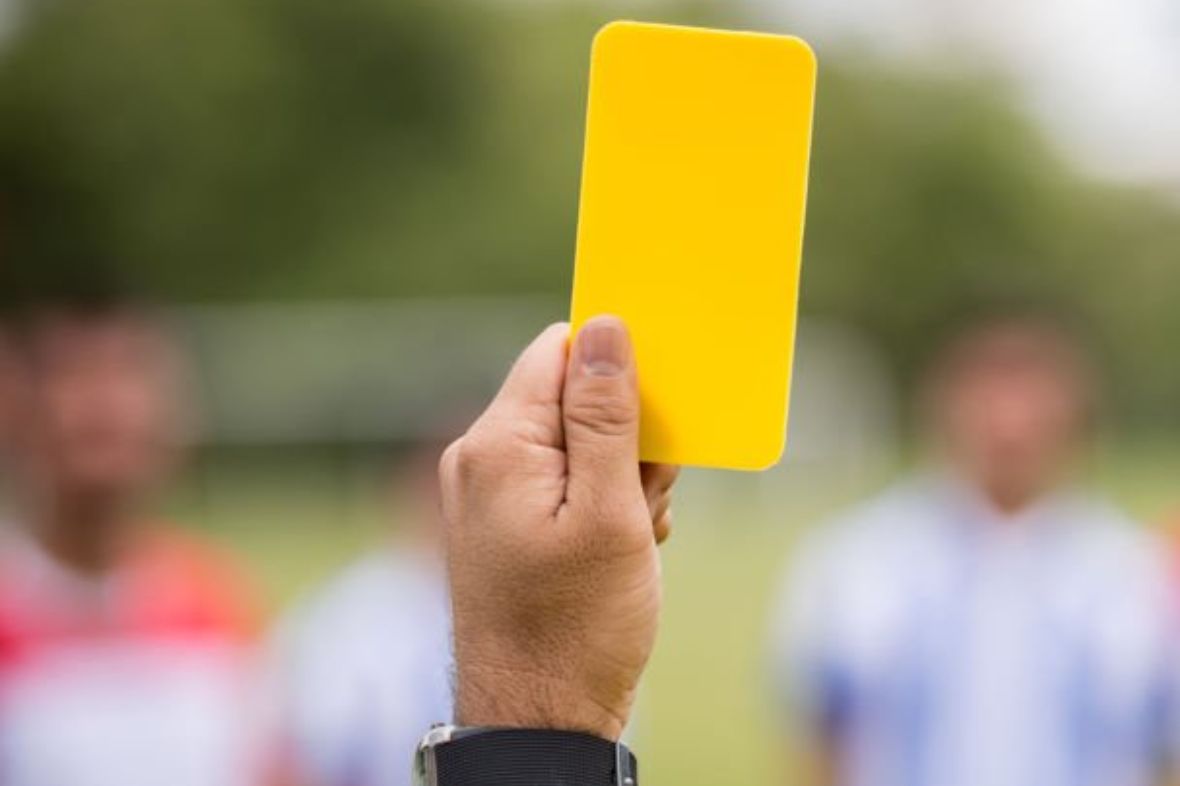 What does a yellow card mean in soccer?